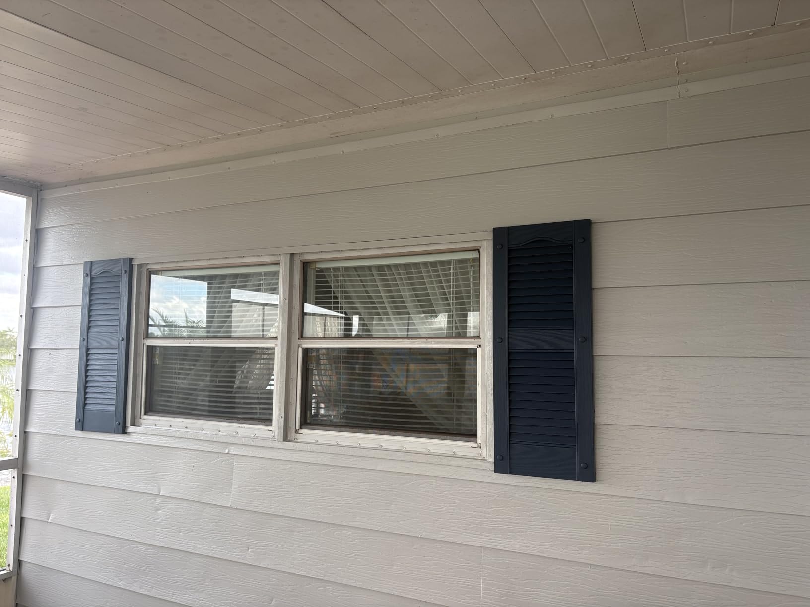 Ekena Millwork Lifetime Vinyl LL1S14X05500BL Standard Cathedral Top Center Mullion, Open Louver Vinyl Shutters, w/Installation Shutter-Lok's & Matching Screws (Per Pair), 14 1/2