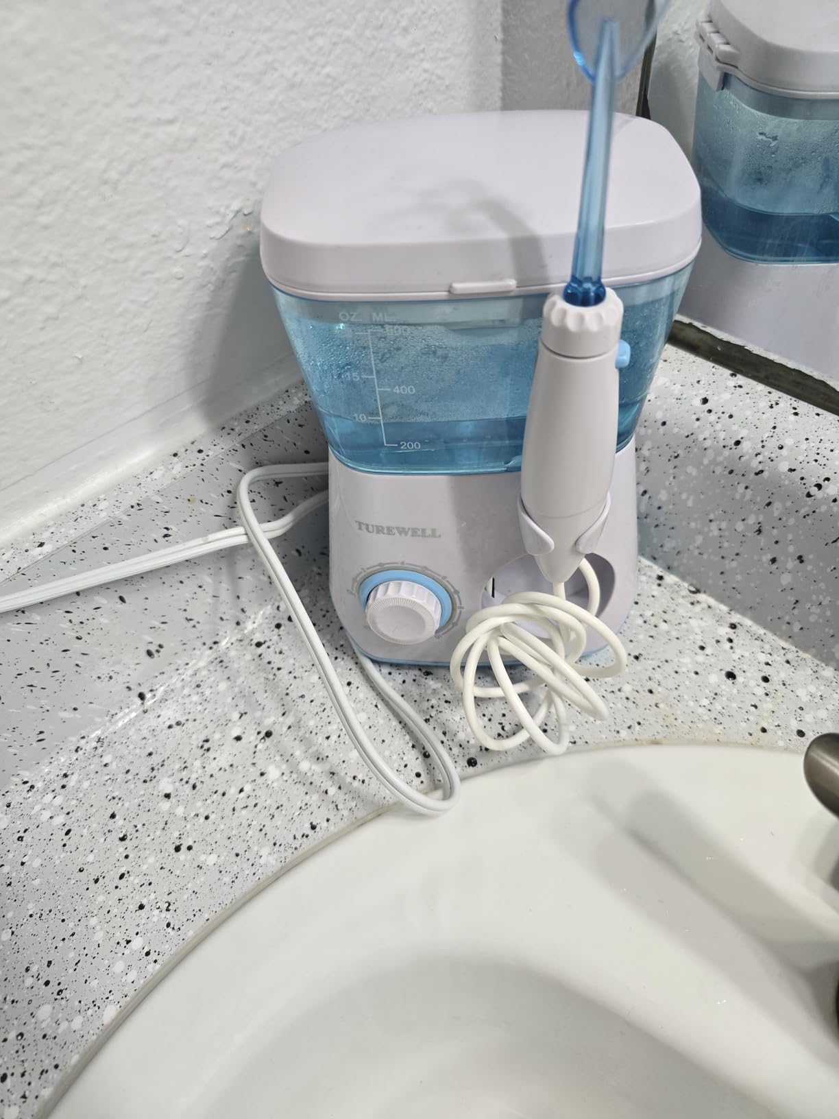 TUREWELL Water Flossing Oral Irrigator, 600ML Dental Teeth Cleaner 10 Adjustable Pressure, Electric Oral Flosser for Braces, 8 Replacement Jet Tips for Family (Black) customer photo 2