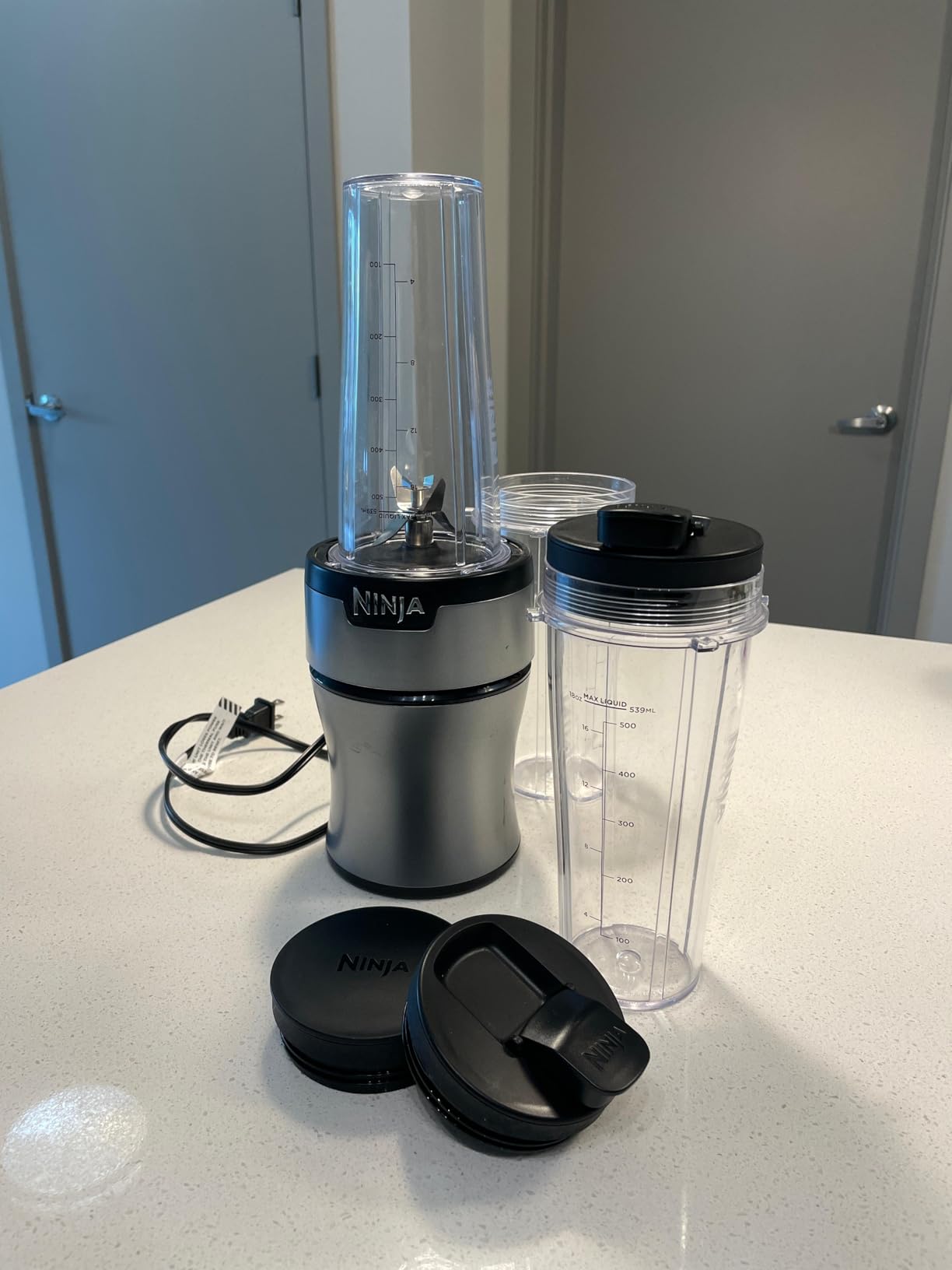 Ninja Nutri-Plus Personal Blender | Compact Push to Blend | Make Frozen Drinks, Smoothies, Sauces & More | With (3) 20 oz. To-Go Cups, (2) Spout-Lids & (1) Storage-Lid | 900 Peak Watt | Silver | BN301 customer photo 2