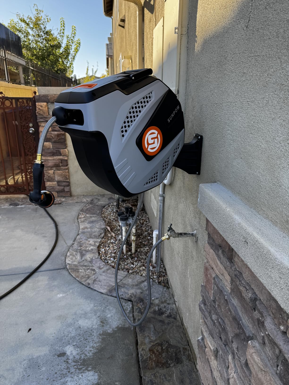 SUNPOW Retractable Garden Hose Reel - 1/2 inch x 50ft Wall Mounted Hose Reel with 3/4 inch Brass Fitting & 10 Function Sprayer Nozzle - Any Length Lock, Auto Rewind System, 180°Swivel Bracket - Grey customer photo 1