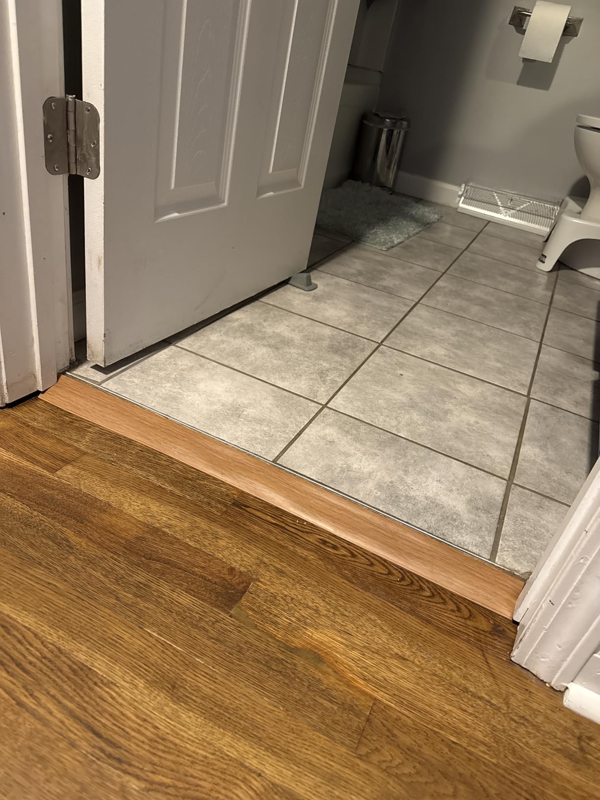 Floor Transition Strip Vinyl Door Threshold Ramp Self Adhesive Carpet Edging Strip Doorway Edge Trim, Overlap Edge Reducer for Laminate Carpet, Floor, Tile (Brown Wood Grain, 1/5' to 2/5', 3.3Ft) customer photo 1