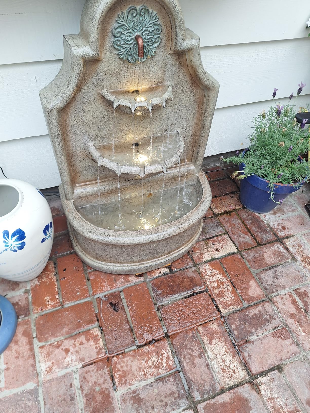 Glitzhome Tiered Wall Mounted Outdoor Water Fountain With LED Light - Vintage European Style 3-Tier Oversized Lion Head Waterfall - Faux Granite, 31.75