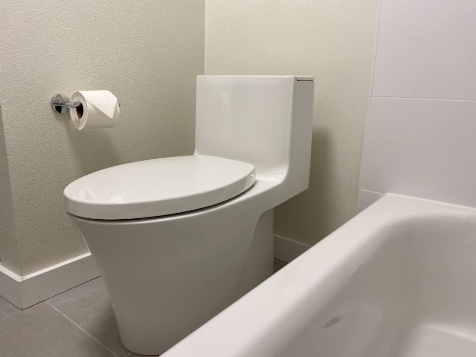KOHLER Veil One-Piece Skirted Toilet, Dual Flush, Elongated Bowl, Skirted Trapway, White, Slow Close Seat, Seat Included, K-1381-0 customer photo 1