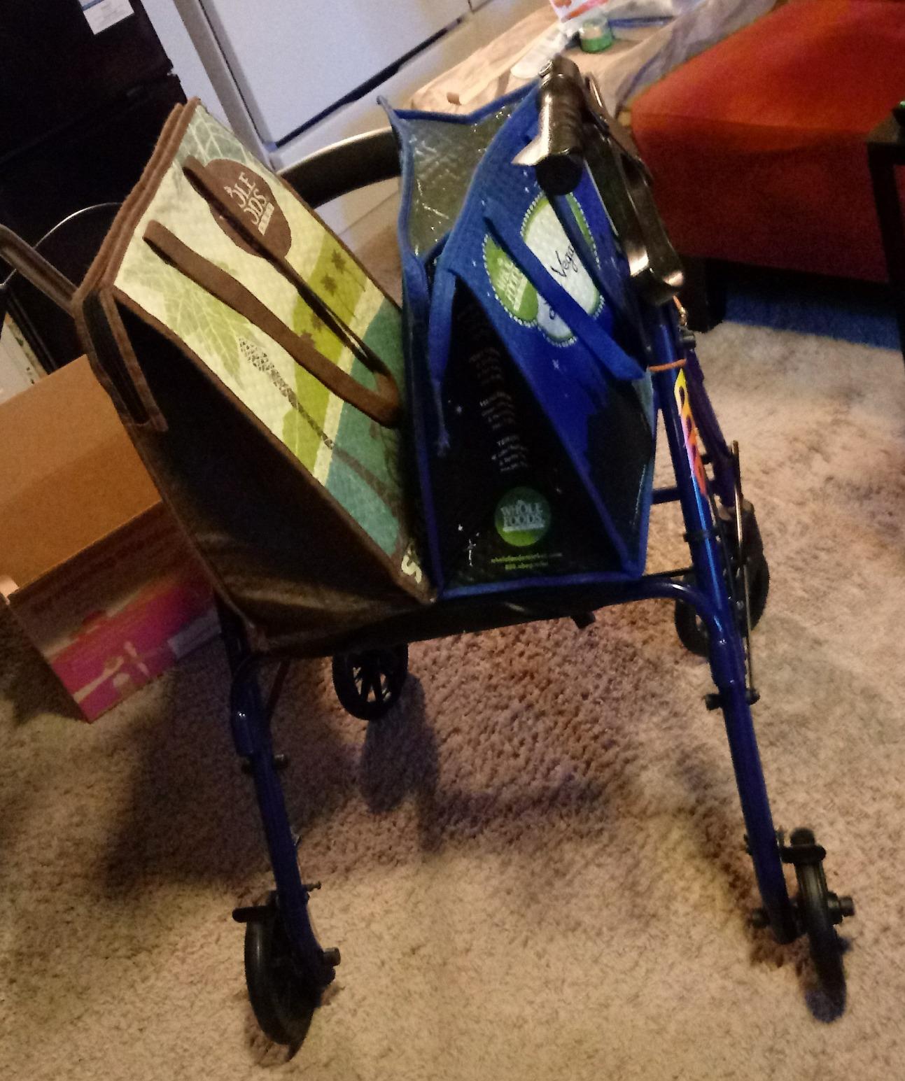 DMI Ultra Lightweight Folding Aluminum Hemi Rollator with Padded Seat, Basket and Adjustable Handle Height, Mobility Walker, Easily Fords, 300 pound Weight Capacity, Titanium customer photo 2