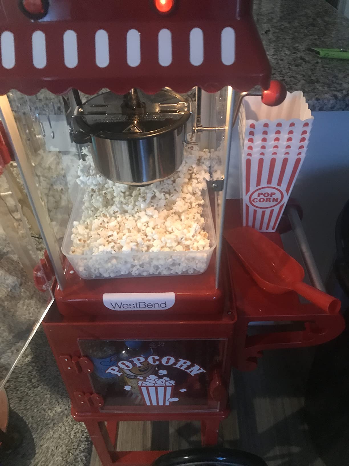 West Bend Popcorn Cart Vintage Theater Style with 2.5 oz Stainless Steel Kettle, Removable Serving Tray, Built-In Storage, Portable Design, 10 Cup Capacity, in Red/Silver customer photo 2